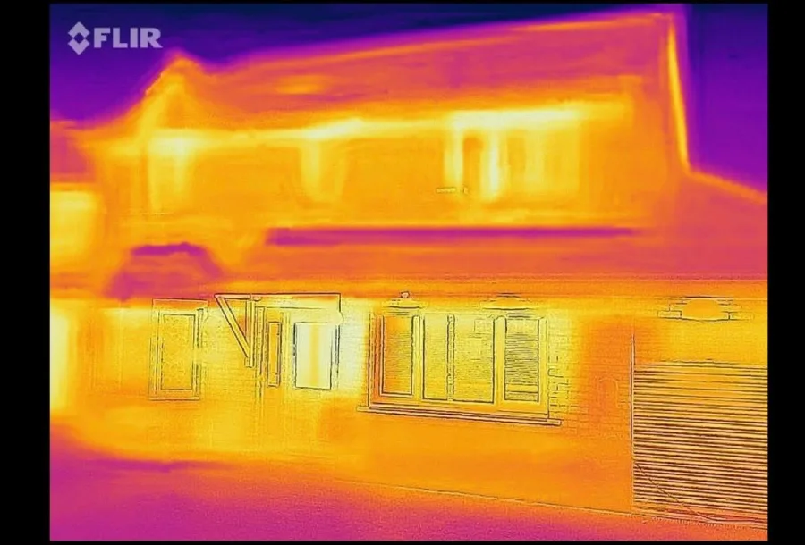 Thermal imaging scan showing heat loss through an exterior wall of a North Texas home